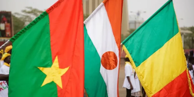 Flags of Burkina Faso, Niger and Mali at a demonstration in support of leaving ECOWAS | Source: Reuters